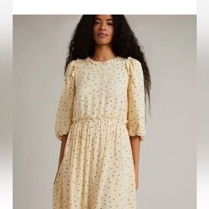 Elegant Cream Dress with Subtle Patterns